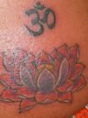 lotus and om symbol tattoo